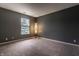 Inviting bedroom featuring neutral paint, plush carpet, and natural light from the window at 16126 Etna Green, Westfield, IN 46074