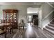 Elegant dining area with a wooden table, chairs, a china cabinet, and hardwood flooring at 16126 Etna Green, Westfield, IN 46074