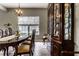 Formal dining room with a long table, seating for six, a china cabinet, and a chandelier at 16126 Etna Green, Westfield, IN 46074