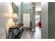 Bright entryway with hardwood floors, a console table, and views into the adjacent living area at 16126 Etna Green, Westfield, IN 46074