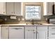 Bright kitchen with white cabinets, a stainless steel sink, and a window looking out to the yard at 16126 Etna Green, Westfield, IN 46074
