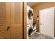Efficient laundry space featuring a stacked washer and dryer unit and ample storage at 16126 Etna Green, Westfield, IN 46074