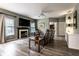 Cozy living room featuring hardwood floors, an electric fireplace, and a leather reclining sofa at 16126 Etna Green, Westfield, IN 46074