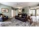 Cozy living room with large area rug, plush leather sofa, and natural light coming in through the front door at 16126 Etna Green, Westfield, IN 46074