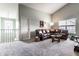 Open-concept living room with a vaulted ceiling, plush carpet, and plenty of space at 16126 Etna Green, Westfield, IN 46074