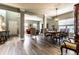 Spacious living room features hardwood floors, a dining area, and access to other parts of the home at 16126 Etna Green, Westfield, IN 46074