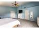 Spacious bedroom with high ceilings, ceiling fan, a cozy bed, and ample closet space at 16126 Etna Green, Westfield, IN 46074