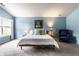 Comfortable bedroom featuring soft lighting, a cozy chair, and a large window for ample natural light at 16126 Etna Green, Westfield, IN 46074