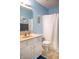 Charming bathroom with blue walls, a white vanity, and baseball themed decor adding a playful touch at 1713 Williamsburg Cir, Franklin, IN 46131