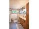 Modern bathroom with wood cabinets, dual sinks, a soaking tub, walk-in shower, and stylish finishes at 1713 Williamsburg Cir, Franklin, IN 46131