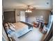 Spacious bedroom featuring a ceiling fan, neutral walls, carpet, and a window for natural light at 1713 Williamsburg Cir, Franklin, IN 46131