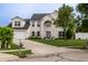 Charming two-story brick home with well-manicured lawn and a spacious driveway at 1713 Williamsburg Cir, Franklin, IN 46131