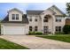 Beautiful two-story brick home with a well-maintained lawn and an attached garage at 1713 Williamsburg Cir, Franklin, IN 46131