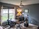 Functional home office with ample desk space, natural light, and neutral decor at 1713 Williamsburg Cir, Franklin, IN 46131