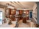 Updated kitchen with dark wood cabinetry, tile backsplash, and a functional center island at 1713 Williamsburg Cir, Franklin, IN 46131