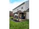 Charming patio with outdoor seating, barbecue, and well maintained lawn at 1713 Williamsburg Cir, Franklin, IN 46131
