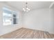 Well-lit dining area featuring a chandelier and expansive windows for natural light at 18967 Seaforth Way, Westfield, IN 46074