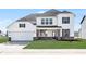 Beautiful two-story home with a two-car garage, brick accents, and manicured lawn at 18967 Seaforth Way, Westfield, IN 46074