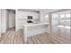 Modern kitchen with white cabinets, stainless steel appliances, and a large center island at 18967 Seaforth Way, Westfield, IN 46074