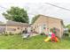 Large backyard featuring a mix of patio and grassy areas, perfect for outdoor activities and relaxation at 1913 Pennsylvania St, Columbus, IN 47201