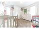 Bright, cozy bedroom with a crib, white dresser, and ample natural light at 1913 Pennsylvania St, Columbus, IN 47201