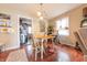 Bright dining area with wood floors, a charming light fixture, and a seamless connection to the living spaces at 1913 Pennsylvania St, Columbus, IN 47201
