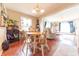 Inviting dining area with warm wood flooring, a pendant light, and an open layout to the living spaces at 1913 Pennsylvania St, Columbus, IN 47201
