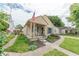 Inviting single-Gathering home featuring a quaint front porch, lush lawn, and a classic American flag at 1913 Pennsylvania St, Columbus, IN 47201