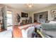 Cozy living area featuring hardwood floors, comfortable seating, and a view into the adjacent dining room at 1913 Pennsylvania St, Columbus, IN 47201