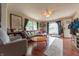 Bright living room with hardwood floors, a comfortable sofa, and large windows for ample natural light at 1913 Pennsylvania St, Columbus, IN 47201