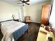 Bedroom featuring a wood floor, ceiling fan, and nice natural light at 199 Fountain Lake S Dr, Shelbyville, IN 46176