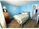 Cozy bedroom featuring hardwood floors and a queen-size bed at 199 Fountain Lake S Dr, Shelbyville, IN 46176