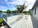 Inviting wooden deck overlooking a serene lake view, perfect for outdoor relaxation at 199 Fountain Lake S Dr, Shelbyville, IN 46176