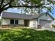 Well-maintained single-Gathering home with an attached garage and beautifully landscaped front yard at 199 Fountain Lake S Dr, Shelbyville, IN 46176