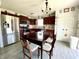 Well-lit kitchen with stainless steel appliances and dark wood cabinetry at 199 Fountain Lake S Dr, Shelbyville, IN 46176