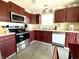 A well-equipped kitchen featuring stainless steel appliances and ample counter space at 199 Fountain Lake S Dr, Shelbyville, IN 46176