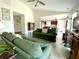 Bright living room with a ceiling fan, hardwood-style floors, and an open entryway at 199 Fountain Lake S Dr, Shelbyville, IN 46176