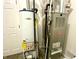 The home's utility room featuring a furnace and hot water heater at 199 Fountain Lake S Dr, Shelbyville, IN 46176