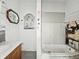 Bathroom in need of remodel, featuring a sink and bathtub at 2006 N Olney St, Indianapolis, IN 46218