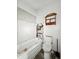 Bathroom in disrepair, featuring a toilet and peeling wall paint at 2006 N Olney St, Indianapolis, IN 46218