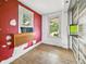 Cozy bedroom featuring a window, hardwood floors, and room for furniture at 2006 N Olney St, Indianapolis, IN 46218
