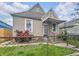 Home with a cozy front porch, tidy front yard, and an inviting entrance at 2006 N Olney St, Indianapolis, IN 46218