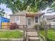 Charming home featuring a cozy front porch, tidy front yard, and an inviting entrance at 2006 N Olney St, Indianapolis, IN 46218