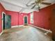 Spacious living room with hardwood floors, good natural light, and freshly painted walls at 2006 N Olney St, Indianapolis, IN 46218