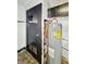 Close up of the water heater in the kitchen at 2006 N Olney St, Indianapolis, IN 46218