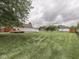 Large backyard featuring a deck and above-ground pool, offering space for outdoor activities and relaxation at 2010 Alexandria Dr, Greenfield, IN 46140