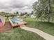 Backyard showing in-ground pool with deck, landscaping, and plenty of room for outdoor activities at 2010 Alexandria Dr, Greenfield, IN 46140