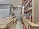 Custom home bar with wood countertop and shelving at 2010 Alexandria Dr, Greenfield, IN 46140