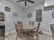 Cozy dining area with a round table and wooden chairs next to the living room area at 2010 Alexandria Dr, Greenfield, IN 46140