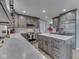 Modern kitchen featuring gray cabinets, stainless steel appliances, and center island at 2010 Alexandria Dr, Greenfield, IN 46140